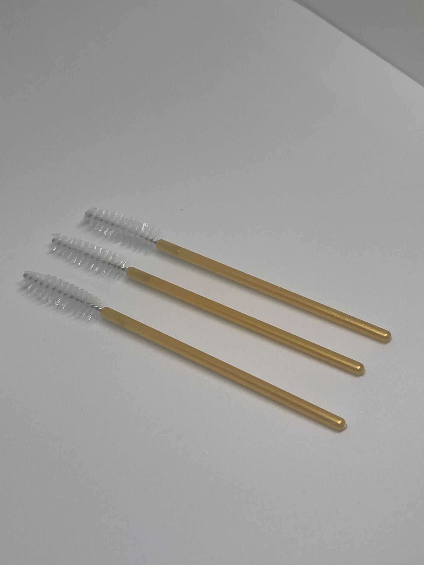 Gold lash brushes